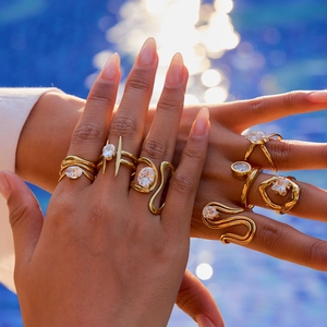 Luxurious gold-plated stainless steel rings with zircon stones on a model's hand