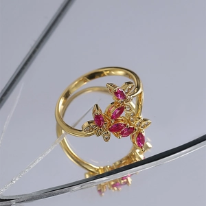 Elegant gold butterfly ring with pink marquise crystals and sparkling diamond accents