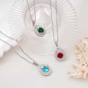 Elegant silver necklaces with emerald green, ruby red, and sapphire blue heart pendants