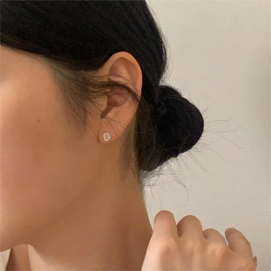 Minimalist 925 sterling silver oval stud earrings for women with a sleek modern design
