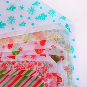Christmas wrapping tissue paper set featuring snowflake, tree and stripe patterns