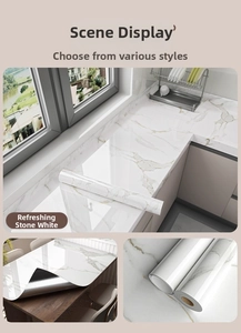 Glossy marble self-adhesive wallpaper in Refreshing Stone White on kitchen countertop