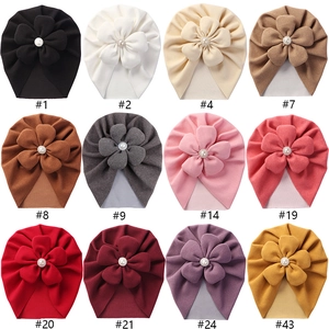 Soft baby turban hats with large pearl flowers in 12 assorted colors for infants