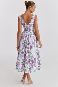 Detail of floral V-neck midi dress featuring an open back and sleeveless summer design