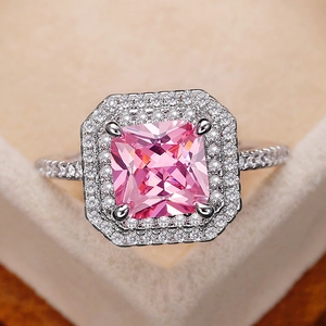 Luxurious silver ring with a square pink zircon center stone and halo pavé setting