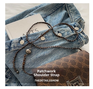 Detail of metal chain and leather spliced shoulder strap with spherical adjustment buckle