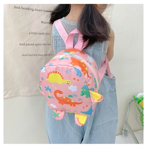 Rear view of a child wearing a pink mini backpack with colorful cartoon dinosaur prints