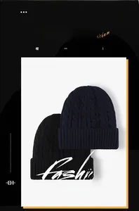 Detail of navy and black cable knit beanies featuring thick textured weave and folded cuffs