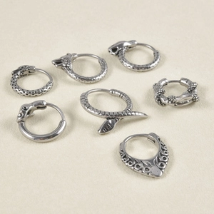 Vintage silver punk snake and skull earring set with detailed engraved gothic patterns