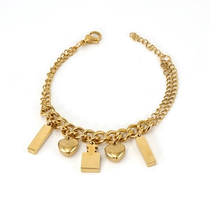 Detail view of 18K gold plated stainless steel bracelet with heart and bar charms
