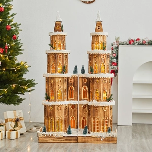Lighted wooden multi-layer Christmas castle with warm LED lights and snowy details