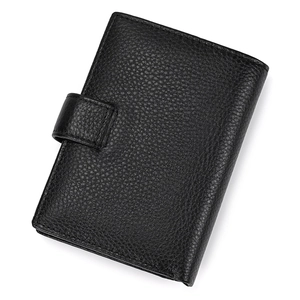 Close-up of black genuine leather wallet featuring litchi grain and snap button closure