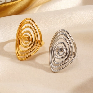 Minimalist spiral stainless steel open rings in gold and silver on silk fabric