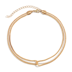 Close-up of gold and silver interwoven chain necklace with adjustable lobster clasp