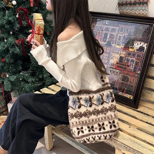 Close-up of plush bucket bag featuring Fair Isle patterns in a festive holiday setting