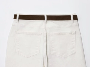 Close-up of white high-waist wide-leg jeans with a dark brown textured belt on the back