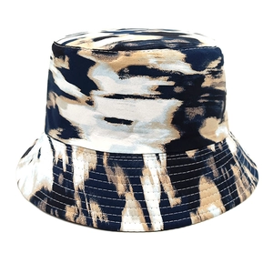 Detail of navy blue and beige tie-dye bucket hat with reinforced brim stitching