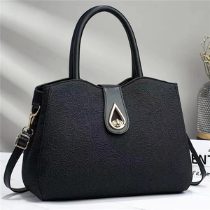 Sac à main élégant en cuir à dentelle noire avec boucle goutte dorée pour femmes