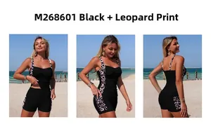 Three-view of black tankini with leopard print straps and side details on a beach