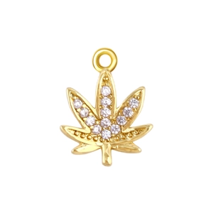 Detailed close-up of a gold leaf pendant with white rhinestones on a white background