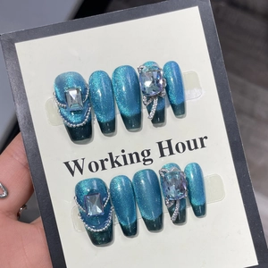 Blue cat-eye press-on nails set with luxury rhinestones and silver metal chains