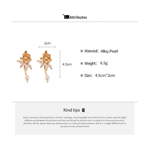 Détail des boucles d'oreilles perles avec dimensions et informations sur l'alliage