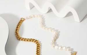 Detail showing the OT buckle and fusion of golden Cuban chain with baroque pearls