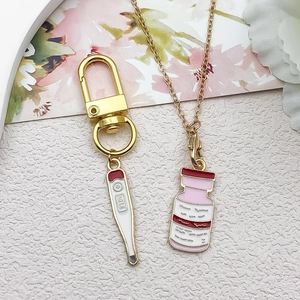 Enamel medical charms with thermometer and medicine bottle shapes for DIY jewelry making