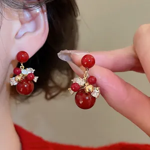 Red zircon firework earrings with gold plating and silver needles for festive occasions