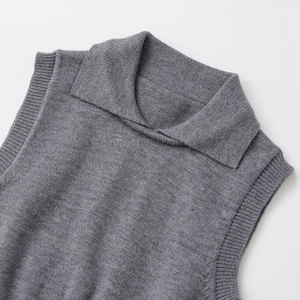 Women's minimalist grey knit polo vest featuring a classic collar and ribbed edges