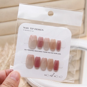 Faux ongles Cat Eye avec dégradé de rose et fini nacré présentés sur carte taille S