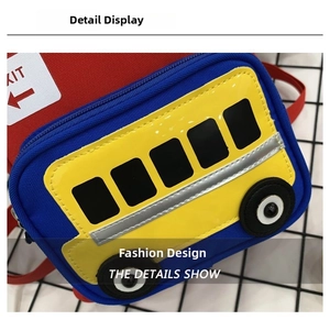 Close-up of cute school bus shaped kids chest bag with 3D wheel details and zippers