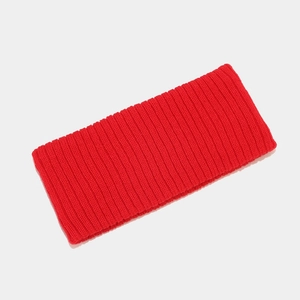 Detail of red ribbed knit texture on a stretchy elastic sports headband or neck gaiter