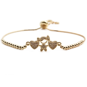 Adjustable gold heart and girl charm bracelet with sparkling cubic zirconia accents