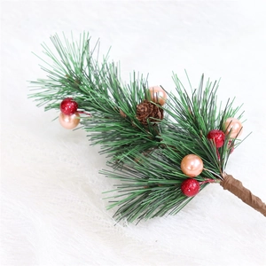 Mini Christmas tree pine branch with red glitter berries and a natural pinecone on fur