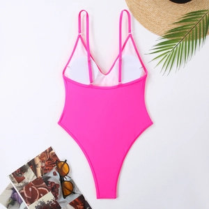 Detail view of neon pink one-piece swimsuit with high-cut design and adjustable straps