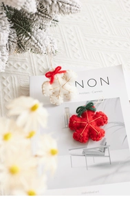 Handmade red and white wool felt snowflake ornaments with gold embroidery for Christmas tree