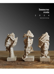 Detailed view of Nordic resin statues on a dark wood base for art decoration