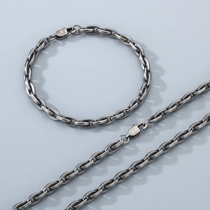 Detail of vintage silver-tone 18k stainless steel chain necklace and bracelet set