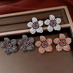 Vintage crystal flower stud earring set in silver, gunmetal, and champagne gold tones