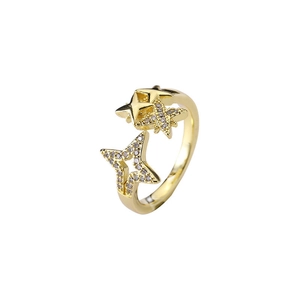 Adjustable gold star ring with cubic zirconia accents on a clean white background