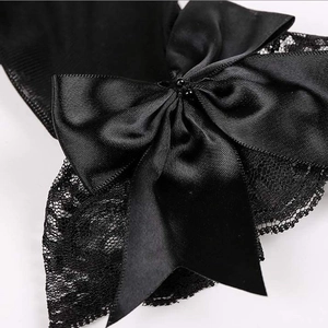 Elegant short black bridal lace gloves featuring a large satin bow and floral pattern