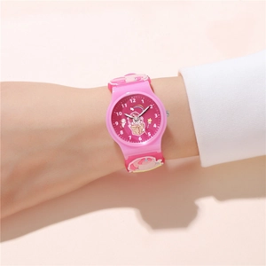 Close-up of pink children watch with unicorn pattern on a soft silicone strap