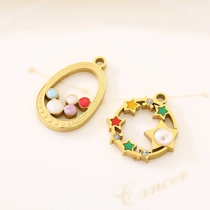 Detail view of 18K gold star and oval charms with colorful beads for jewelry making