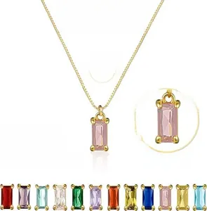 Detail of 18k gold plated necklace featuring a pink emerald cut zircon and 12 color options