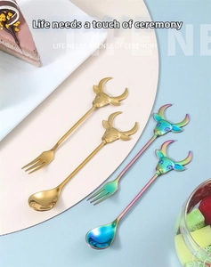 Detail of 304 stainless steel dessert spoons and forks with bull head handle designs