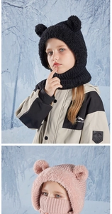 Detail of pink and black children knitted bear hat with built-in scarf and mask for winter