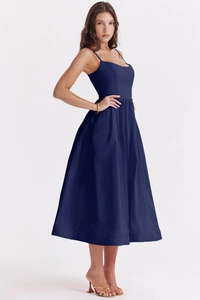 Detail of navy blue backless sundress with thin straps and elegant A-line flared hemline