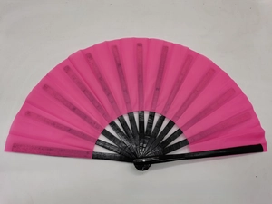 Detailed view of vibrant rose pink fabric fan surface with premium black bamboo frame