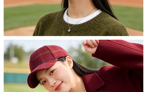 Detail of red plaid wool baseball cap worn with a stylish burgundy coat and gold necklace